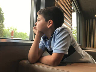 Child looking out of a window